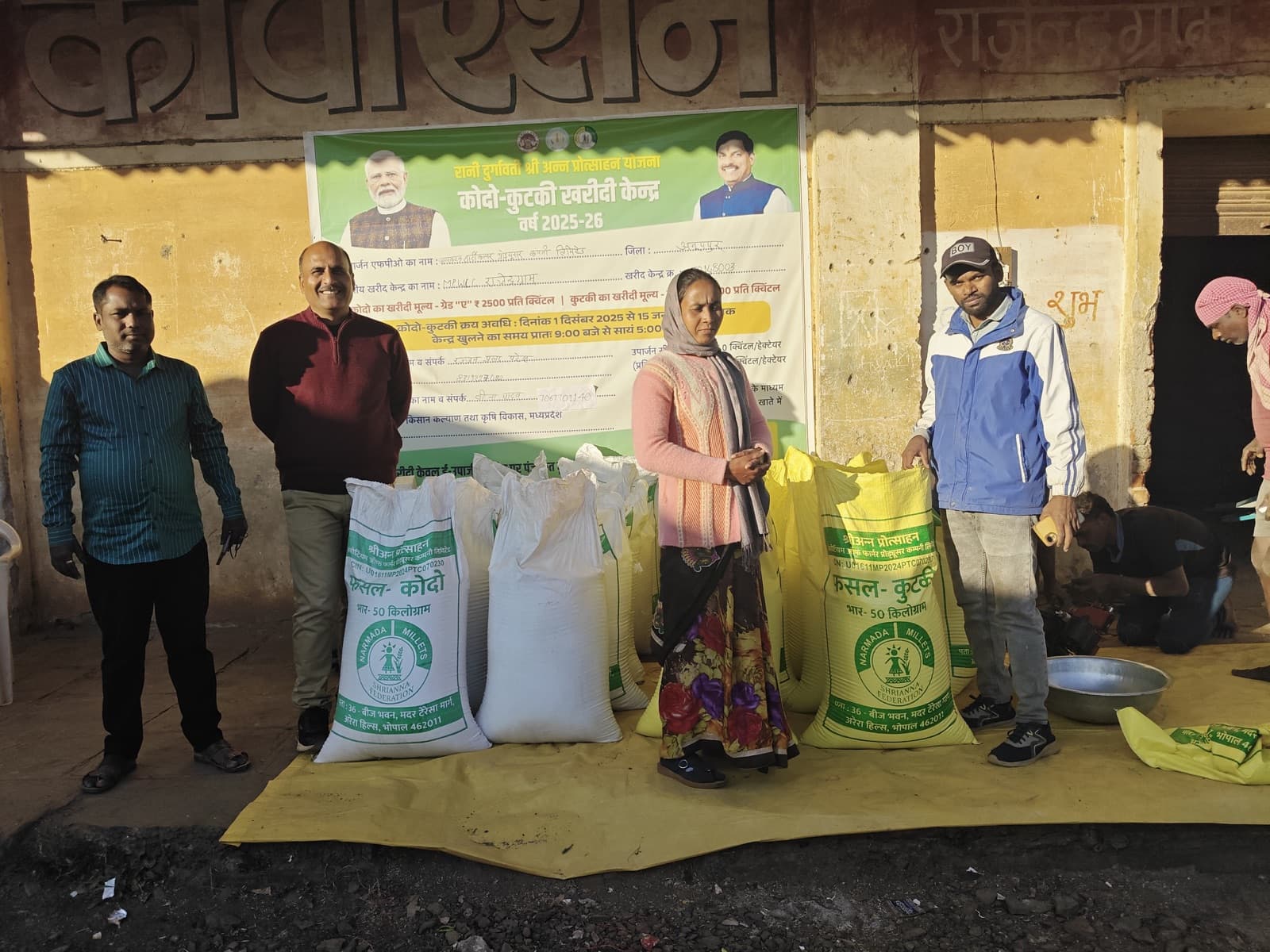 Farmers and staff with Kodo and Kutki bags at a procurement centre